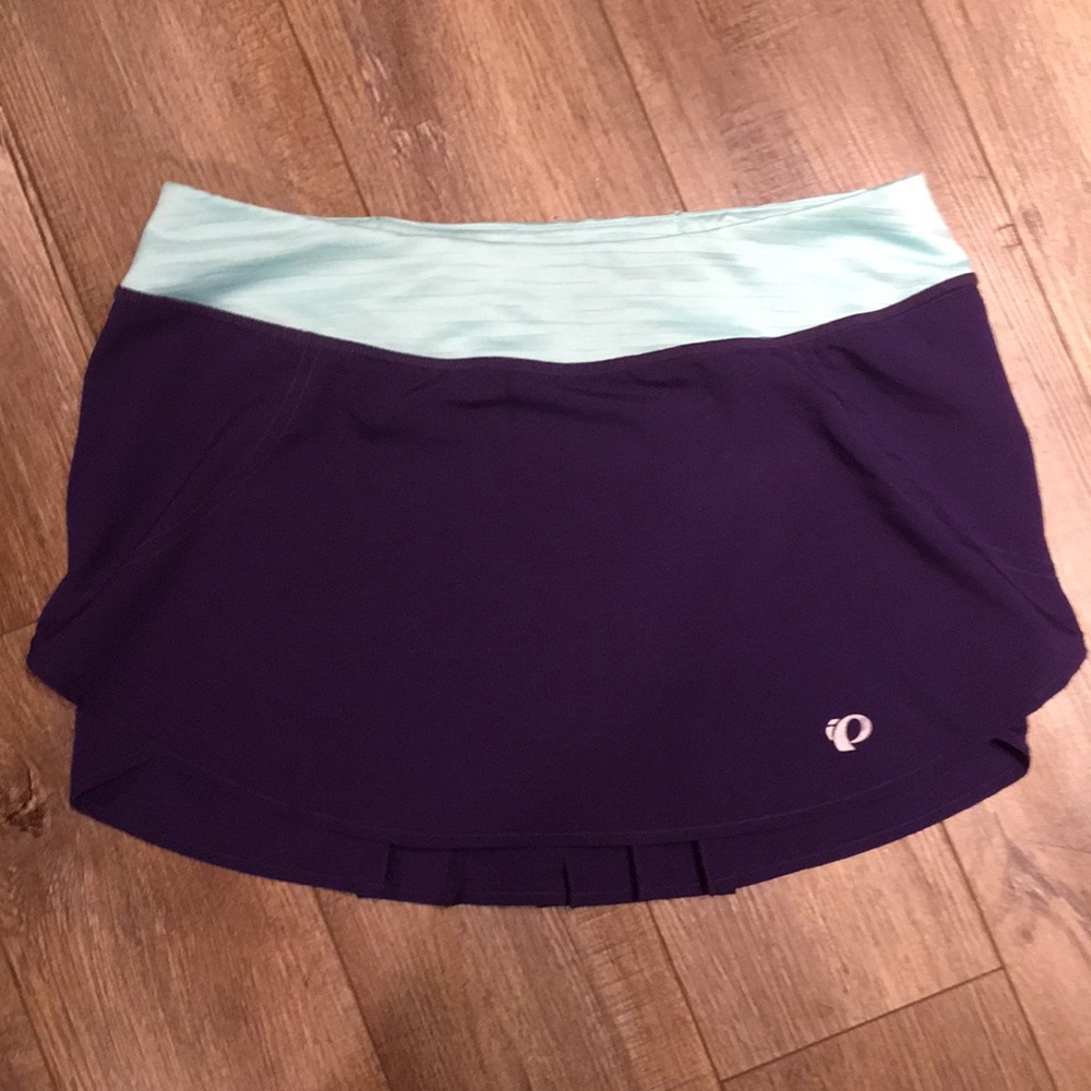 Pearl Izumi athletic purple fly pleated skirt